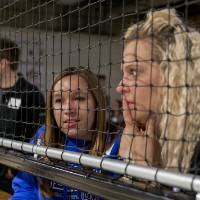 Two alumnae watch the fowling game at the Fowling Fun Event